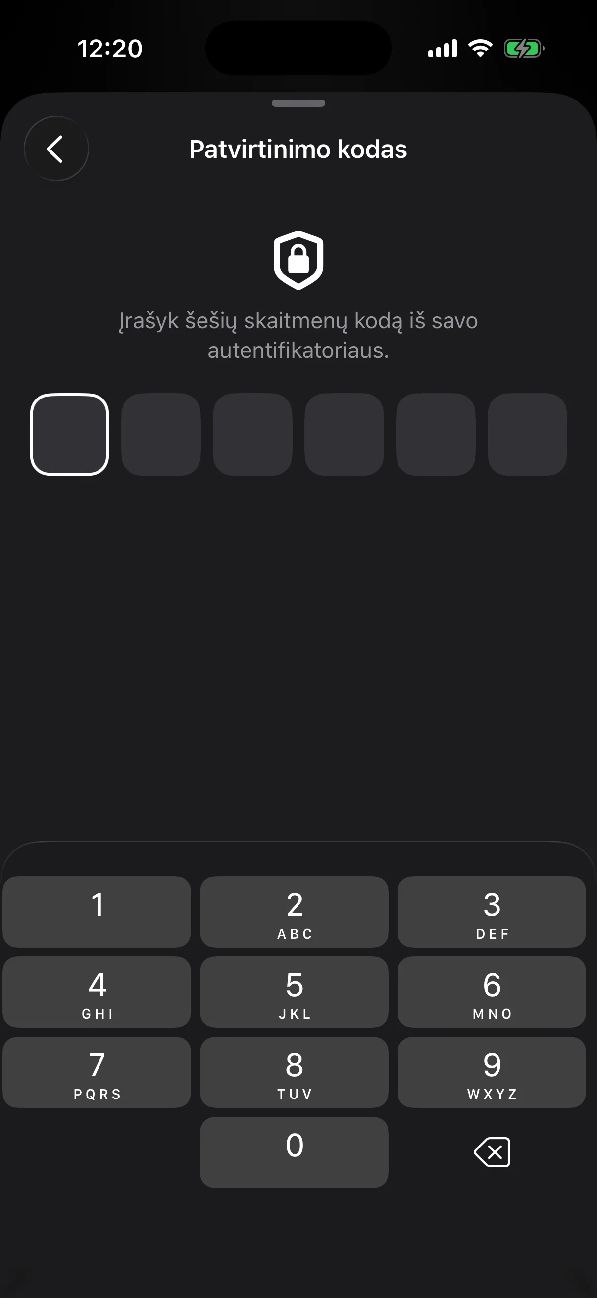 The two-factor step: six empty boxes for the code from an authenticator app, above a number pad